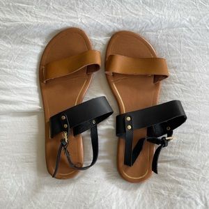 Women’s Report Black and Tan Sandals